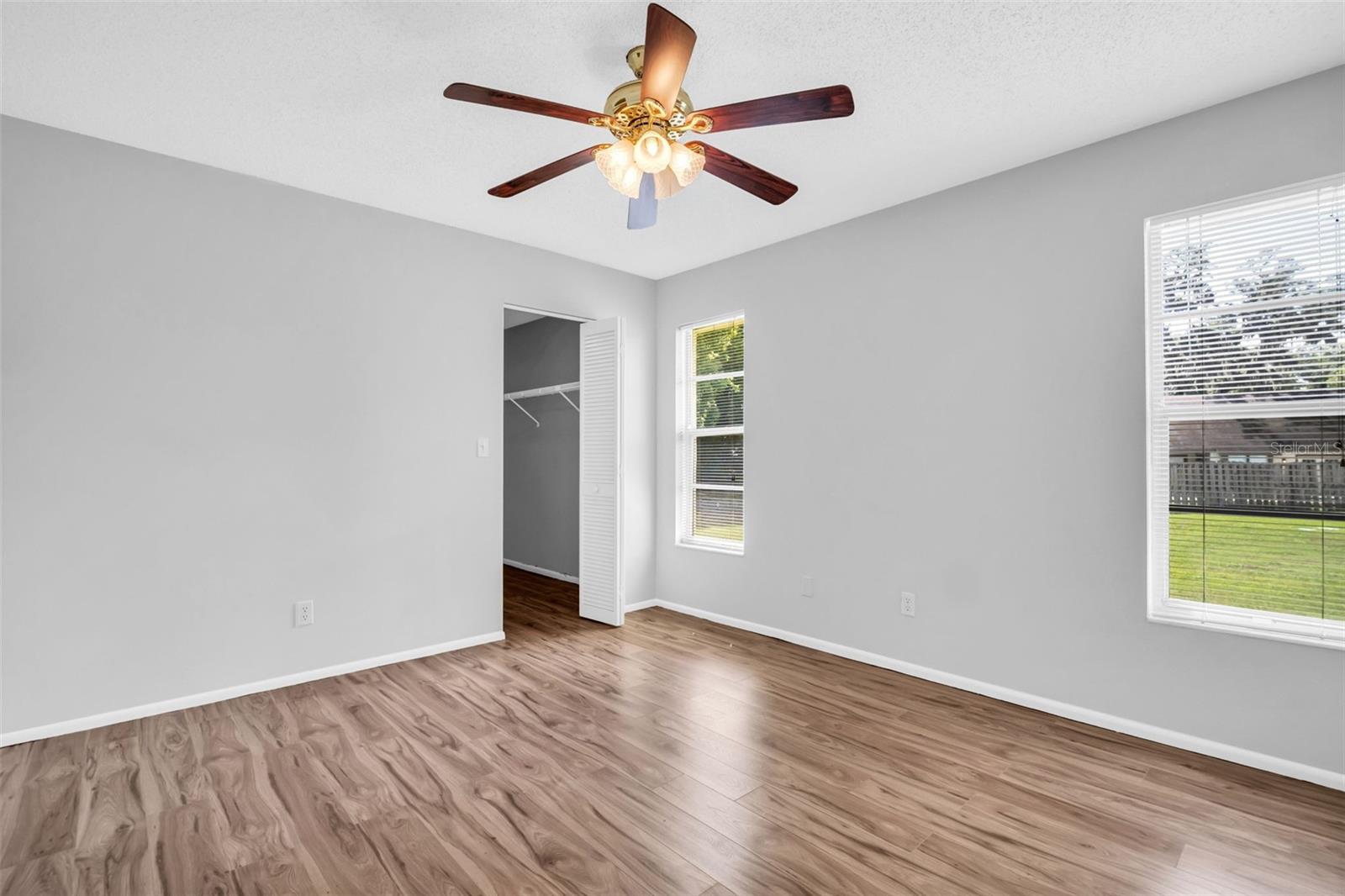 Large guest suite with peaceful green views & oversized walk-in closet~