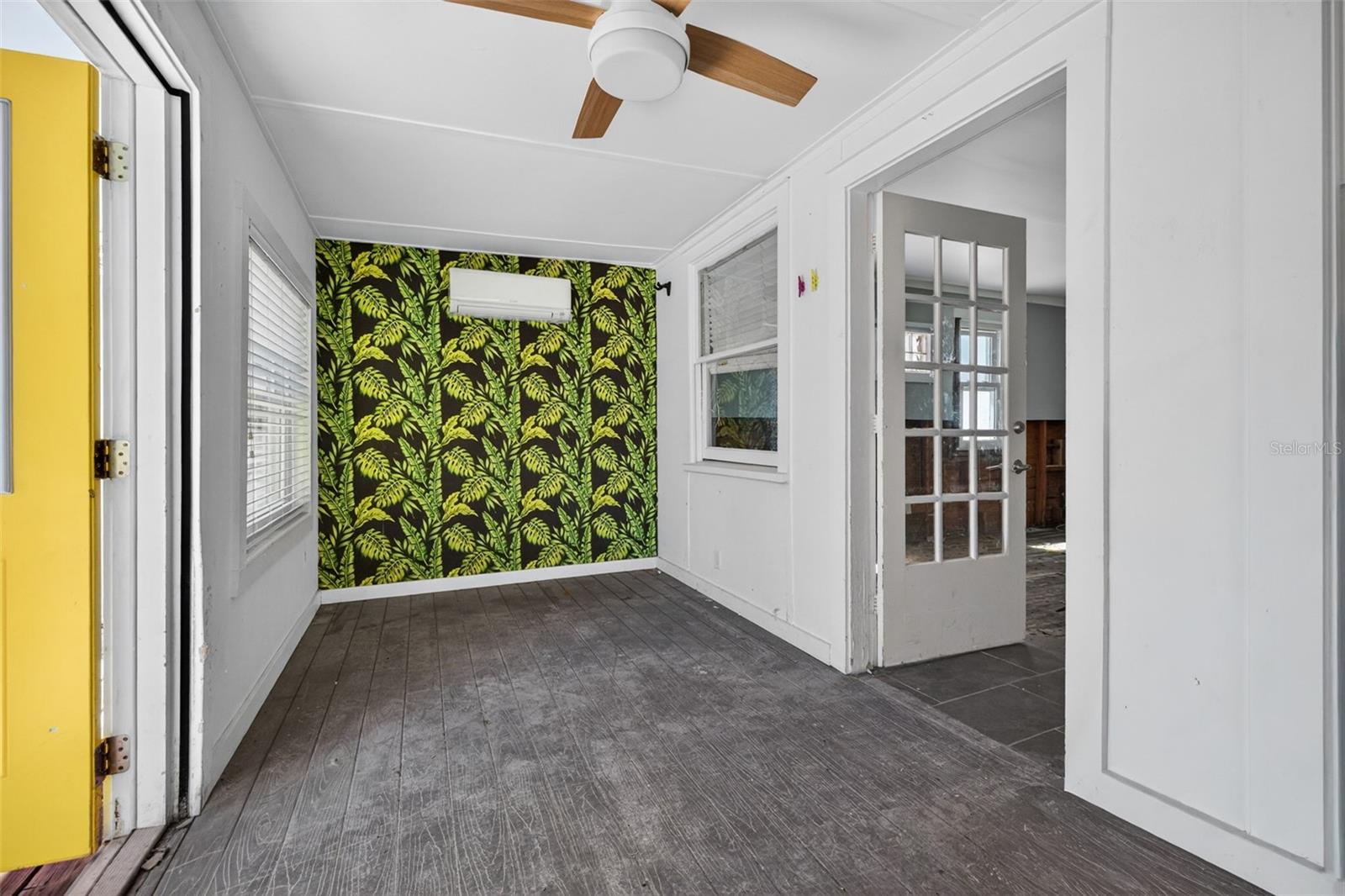 Sneak Peak, the entry/ florida room complete with mini split, hurricane windows, ceiling fan room size 188 sq ft not included in heated measurement on public records