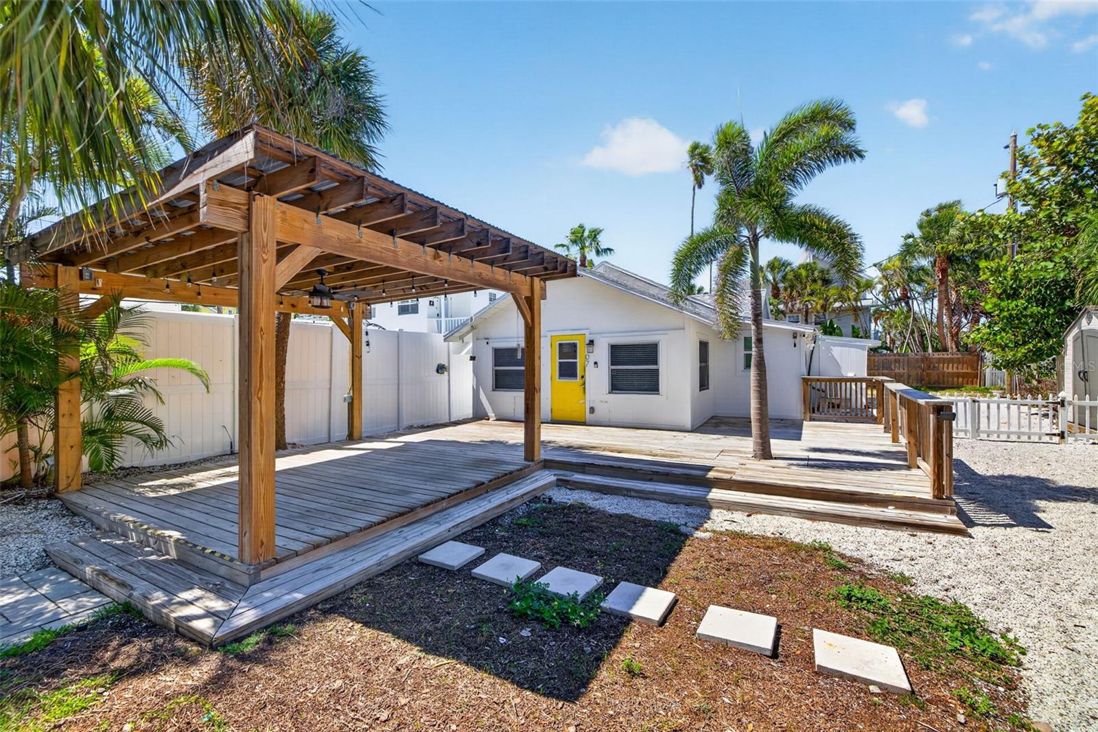 New oversized wood with tin roof Pergola, Deck, 8' Vinyl Fence next to the Triplex. Fully Fenced.