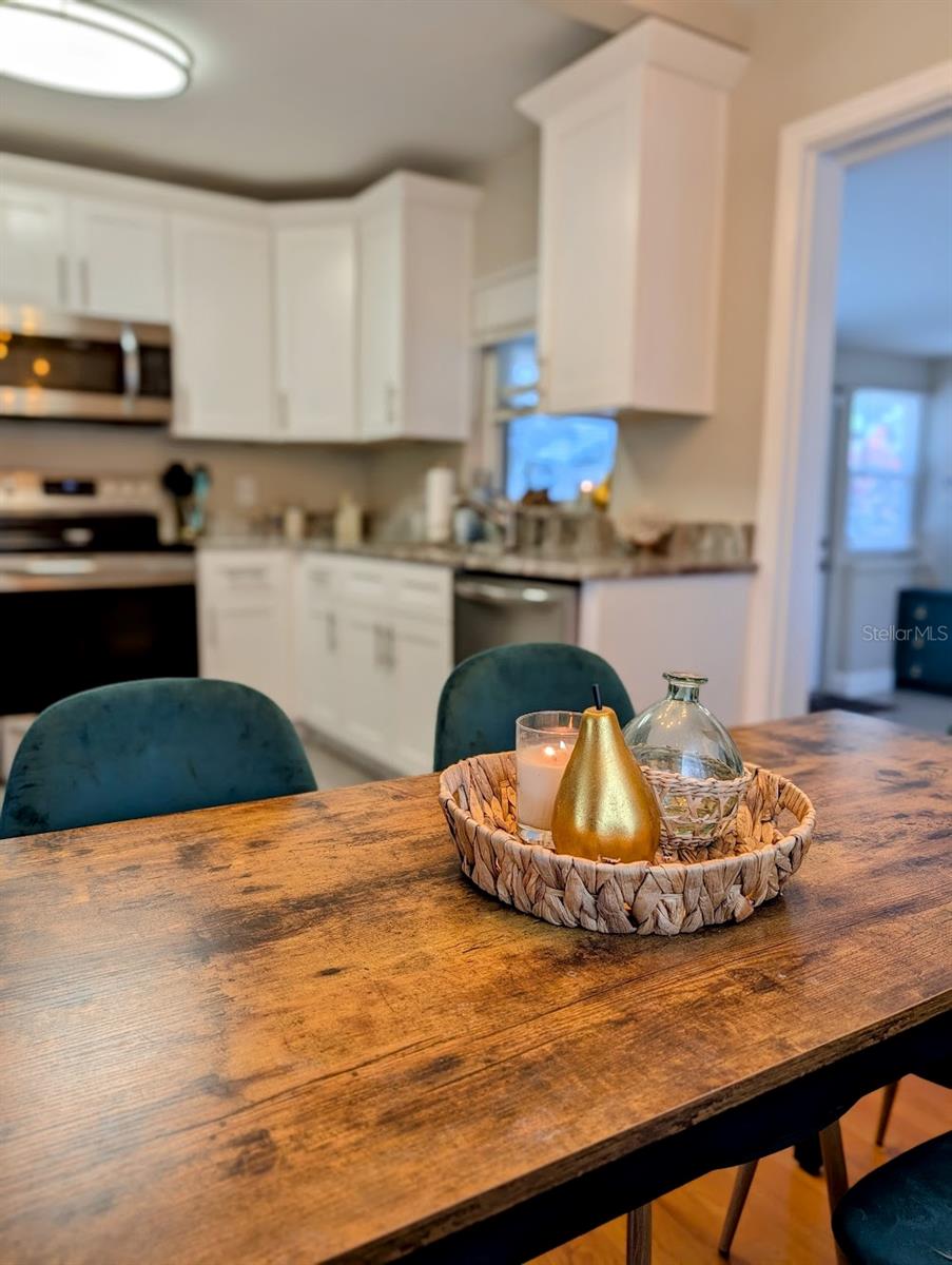 Dining Table with Kitchen Background