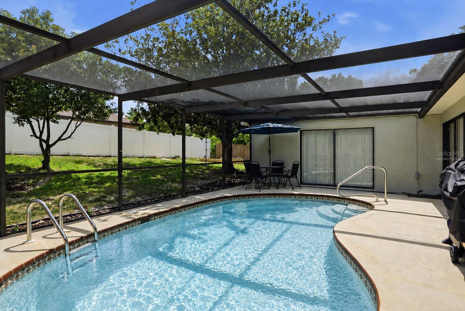 Virtually staged with pool resurfaced.