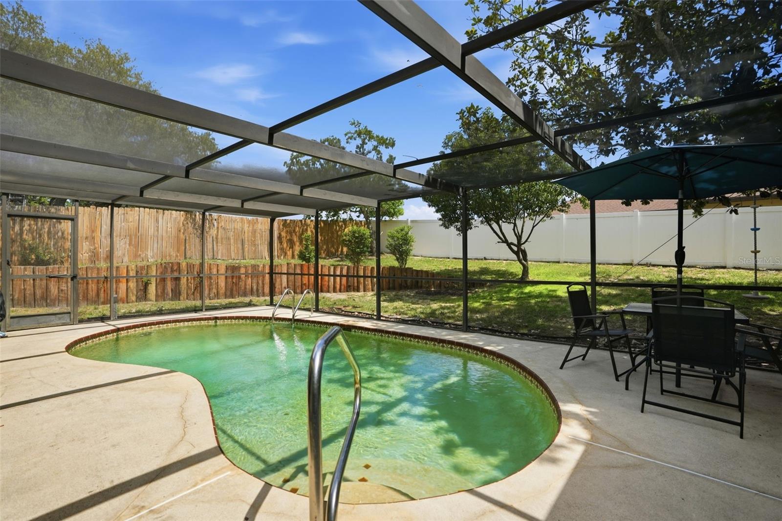 Private pool. Screen enclosure. Needs resurfacing.