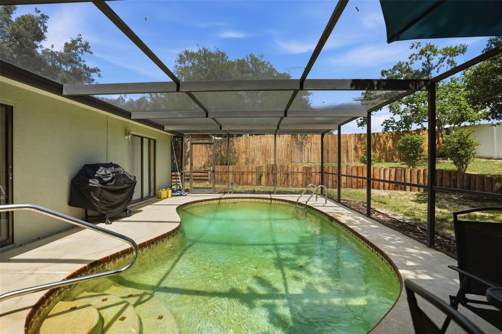 Private pool. Screen enclosure. Needs resurfacing.