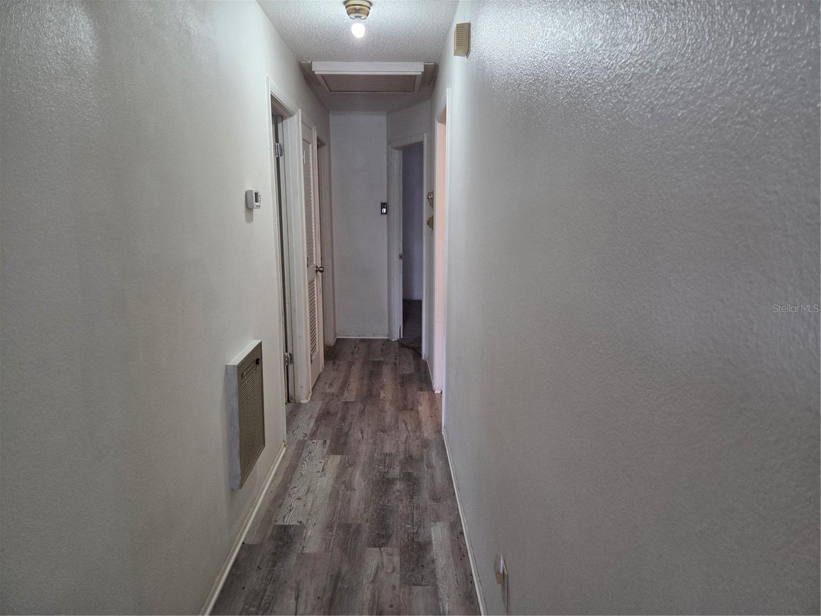Hallway has vinyl looring