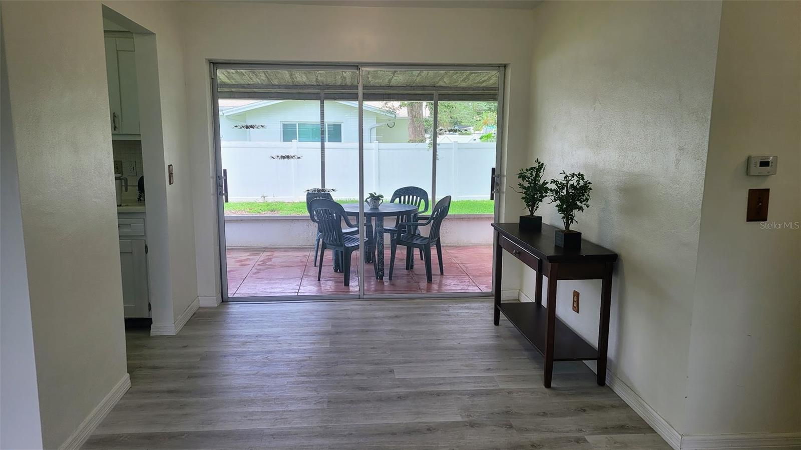 Dinette area just off the kitchen and view of the screened porch