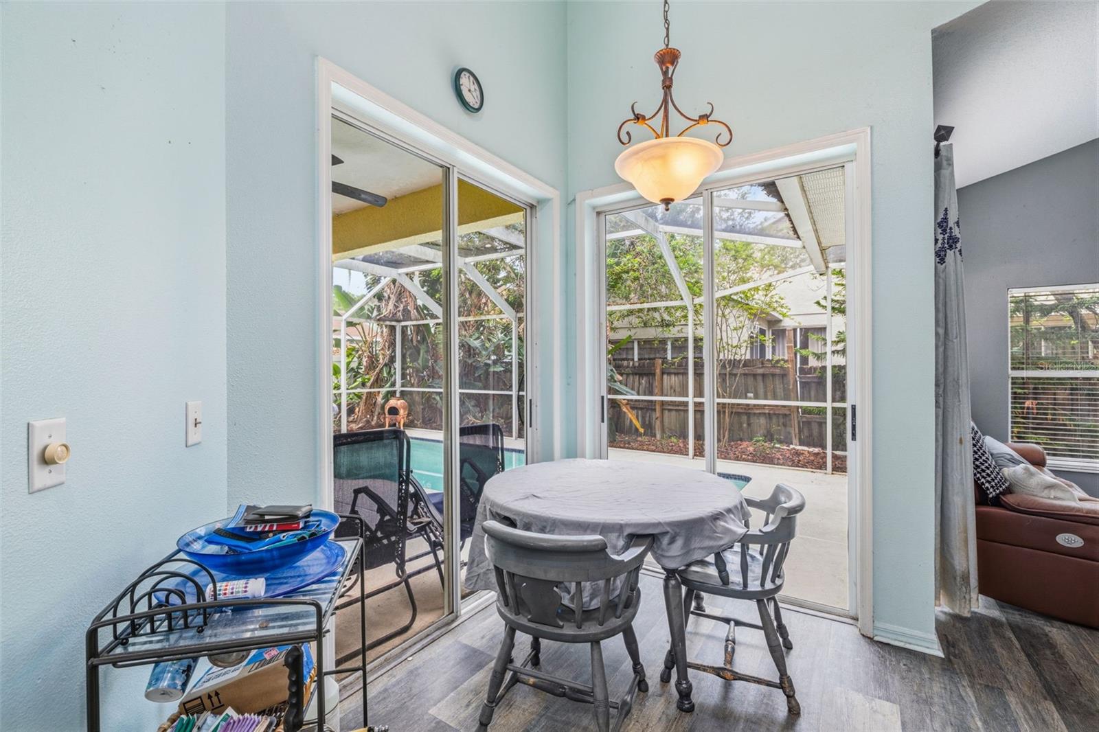 Corner Breakfast nook with two 9ft sliders to the enclosed lanai.