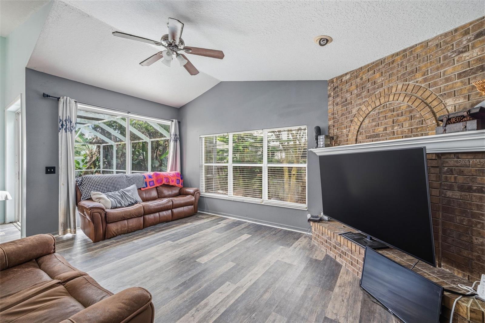 Another view of the family room with a large 9ft sliding door access to the enclosed lanai/pool.