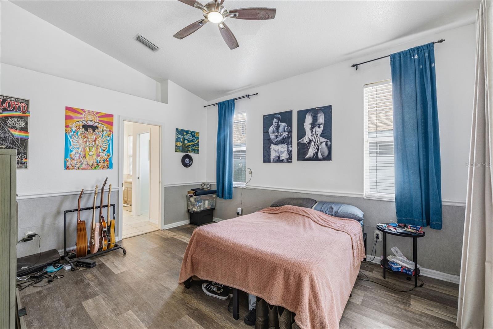 Large primary bedroom complete with 4 piece en-suite, walk-in closet and sliding glass doors to the enclosed lanai/pool.