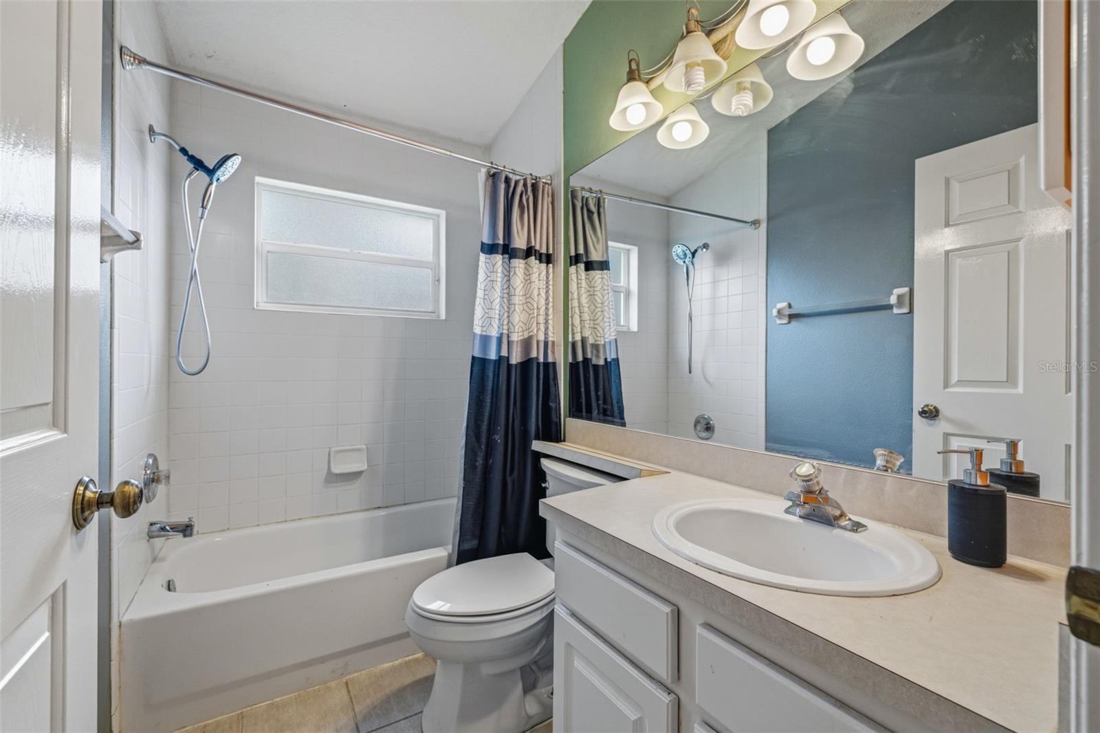 Full secondary bathroom with tub/shower combo
