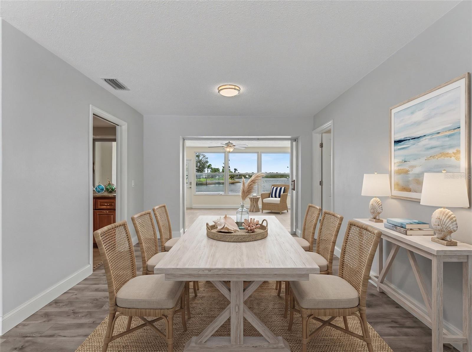 Dining Room with access to the Florida Room overlooking the canal
