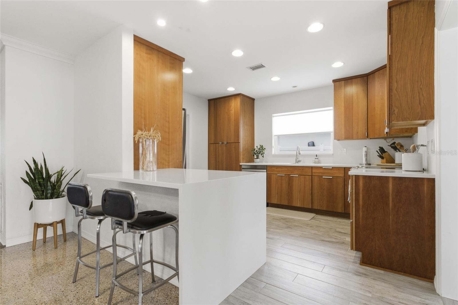 Bar seating and Kitchen