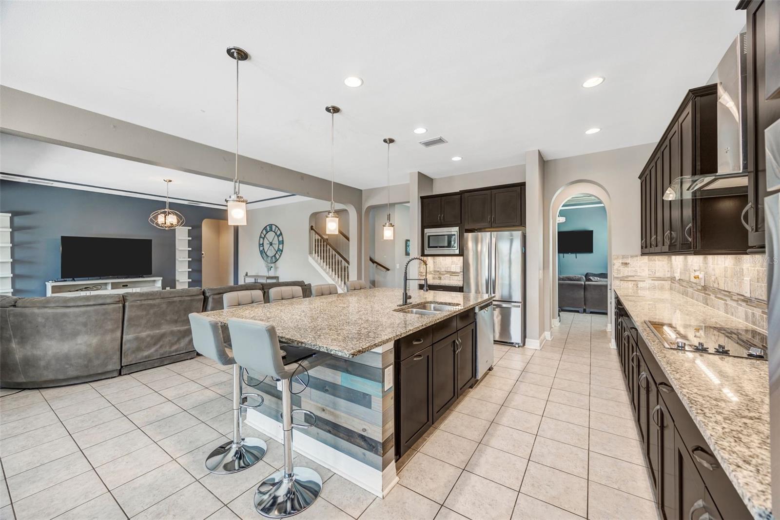 Kitchen with large island overlooking Family room