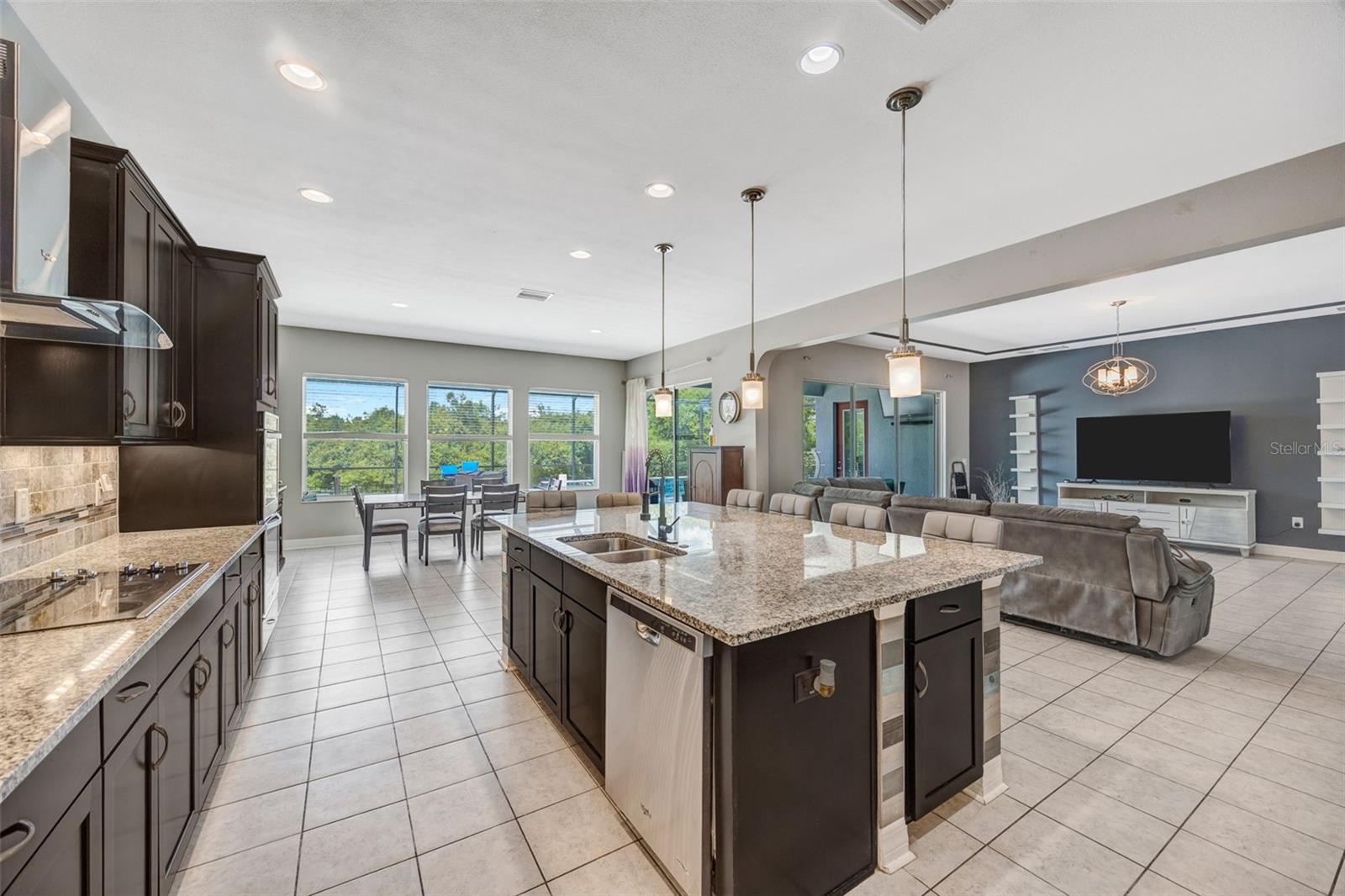 Kitchen with large island overlooking Family room