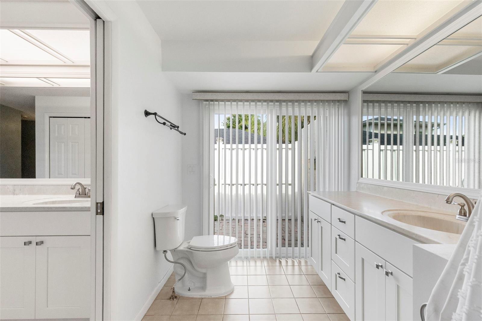 Access to large fenced side yard with paver flooring, located off primary suite this would be a great place for unwinding and enjoying the outdoors, potential for hotub here