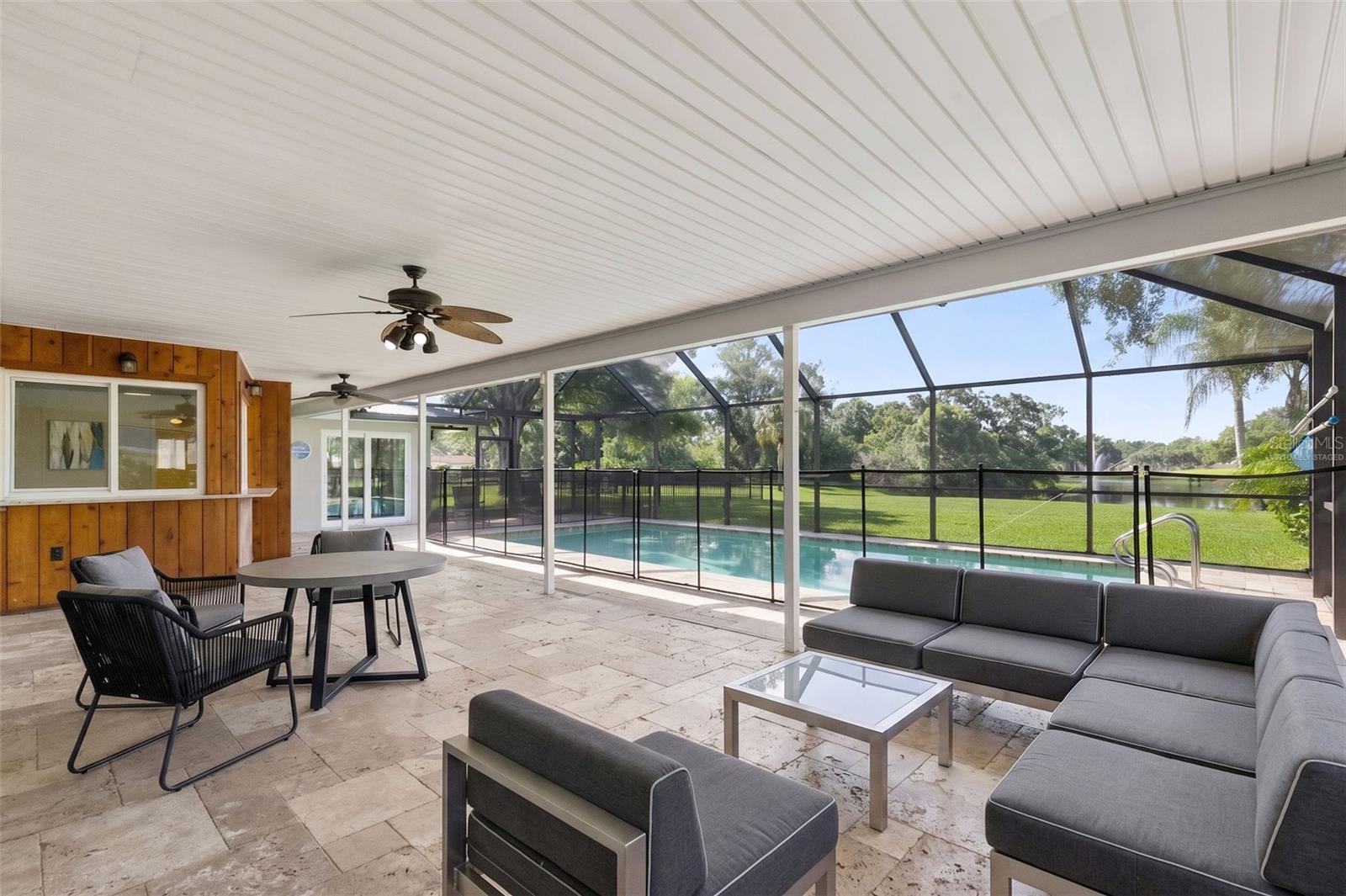 Virtually staged screened in patio setup
