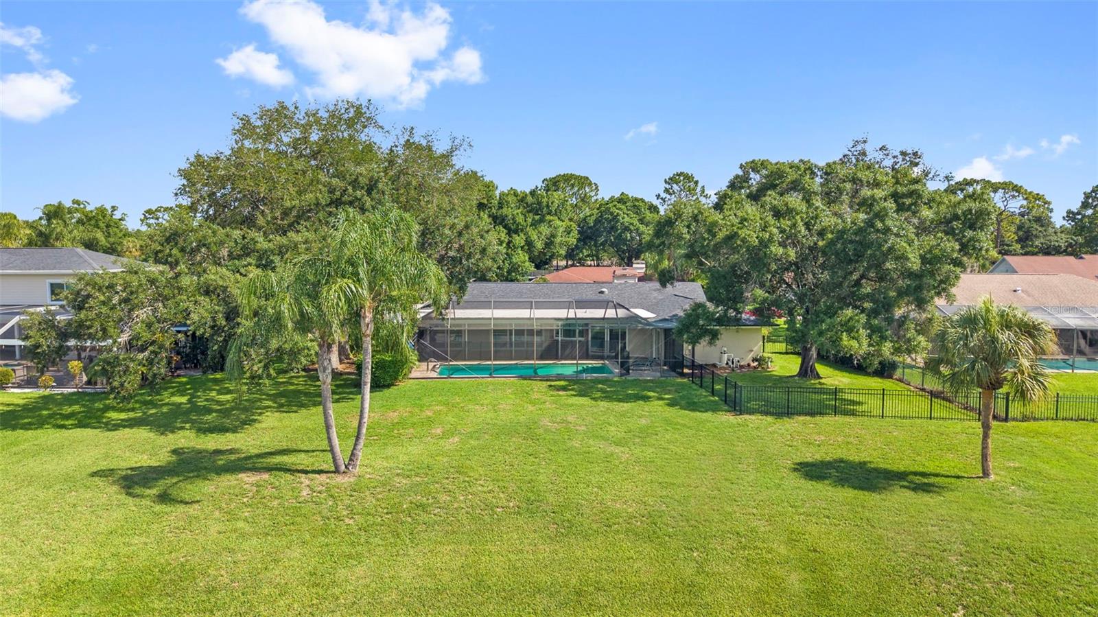 Backyard extends several feet beyond enclosure