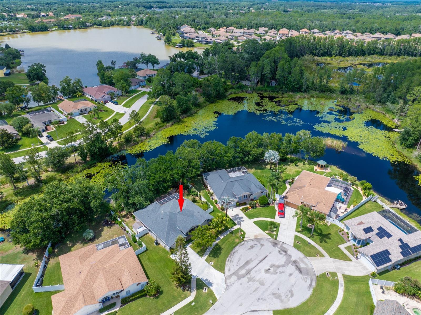 DRONE SHOT OF HOME AND SHOWING LAKE