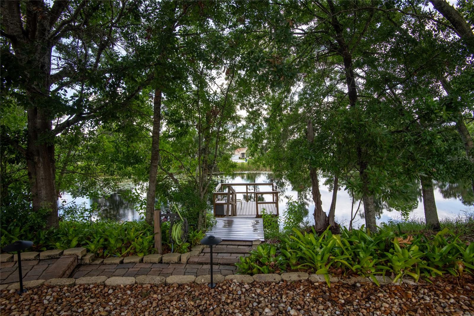 VIEW OF DOCK AND LAKE FROM LANAI