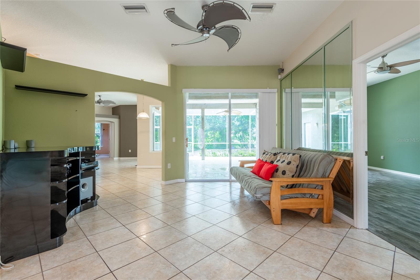 FROM GREAT ROOM SHOWING SOUNDS SYSTEM LOOKING INTO LANAI