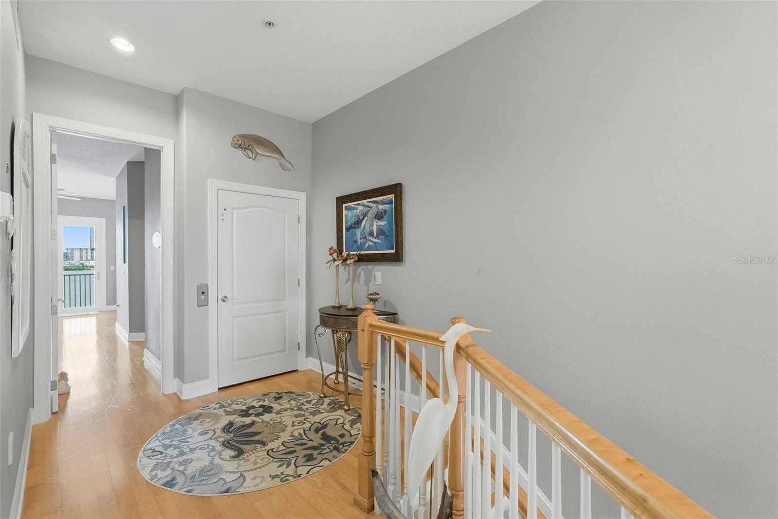 Stairway up to the third level (don't forget, you can also take the private elevator!) which includes the master, guest bedroom on opposite end and the laundry room.