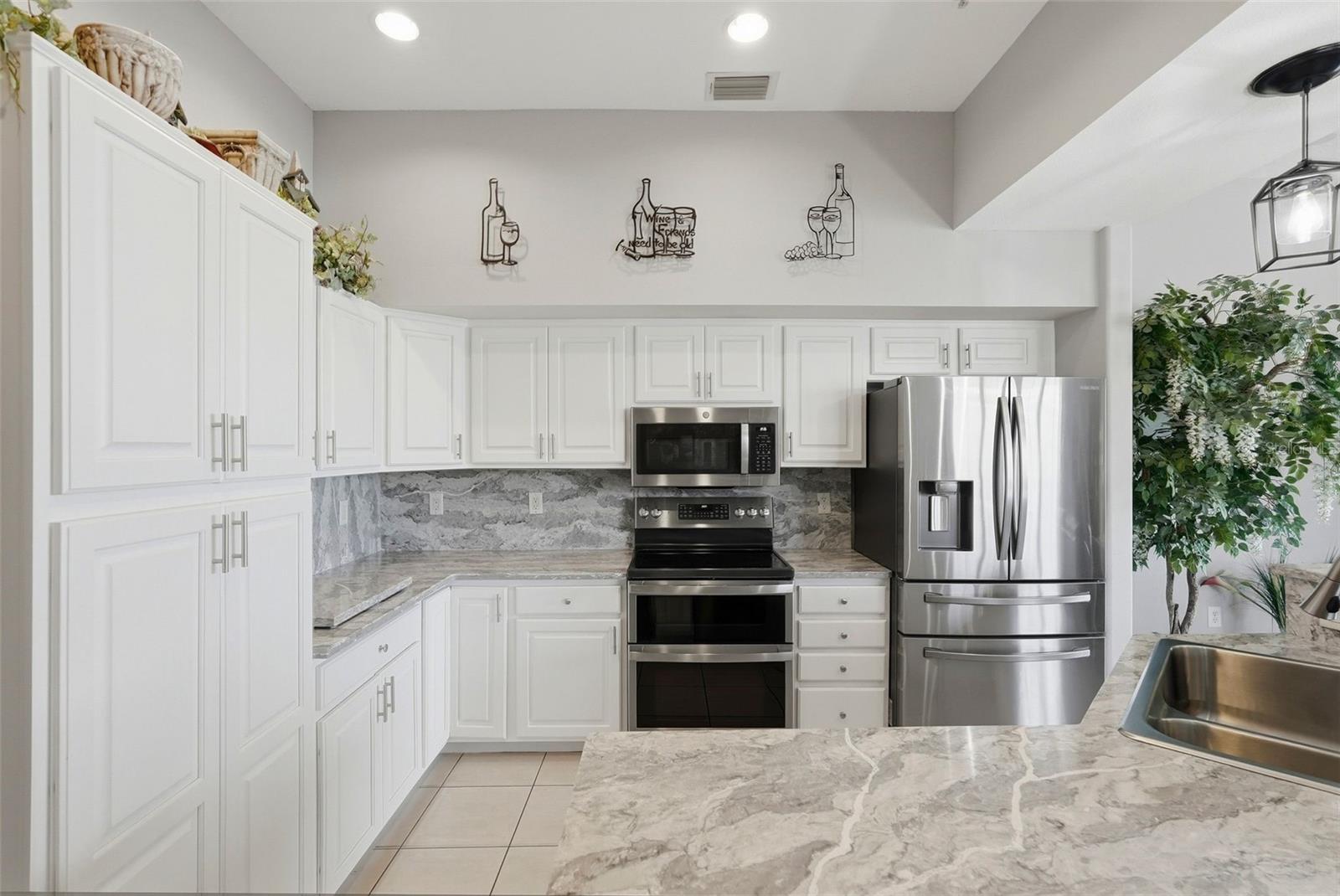 Kitchen with an oversized quartz island