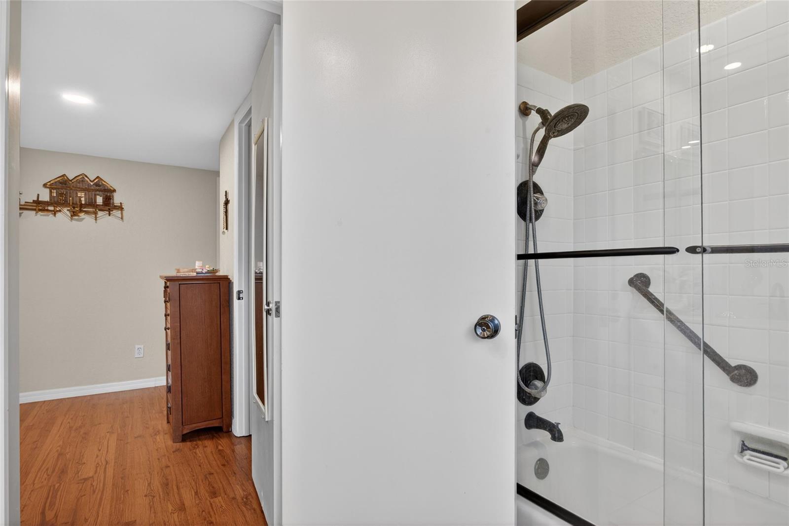 shower tub and handicap bars in main bath