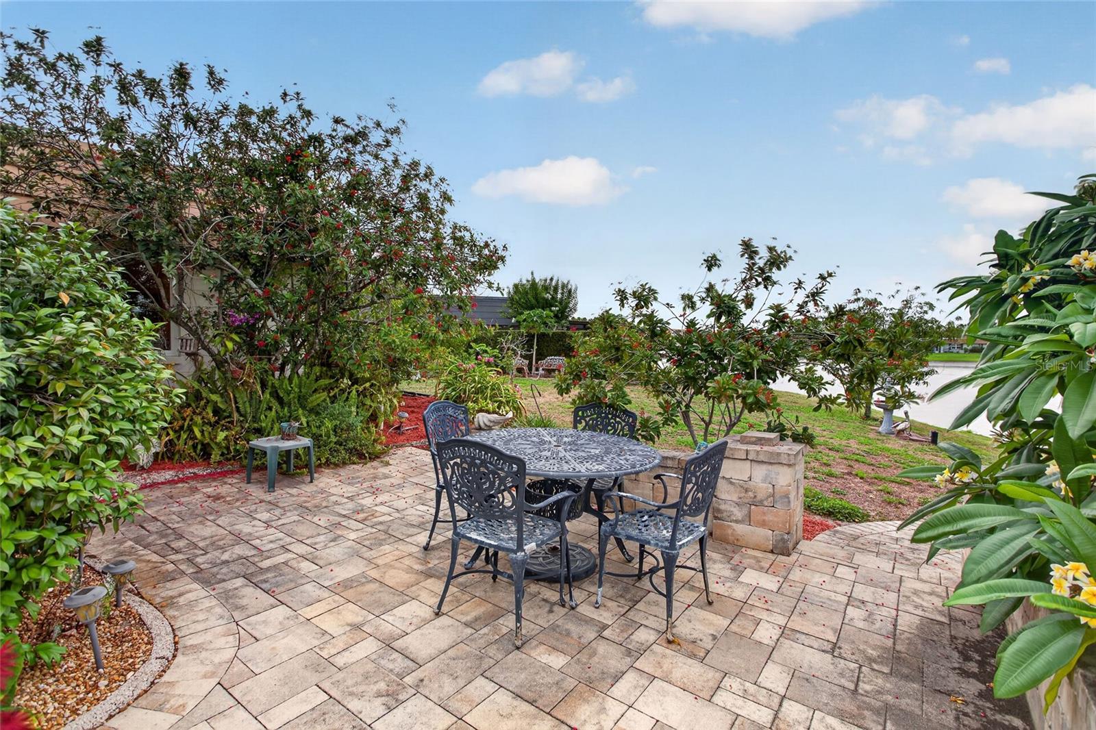 open paver courtyard with paver bench seating