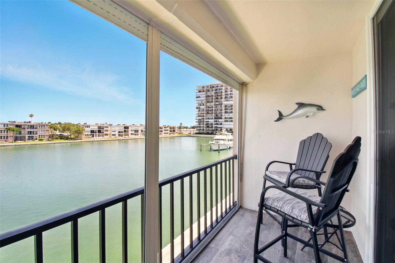 This stunning waterfront patio offers panoramic views and a serene setting for outdoor living.