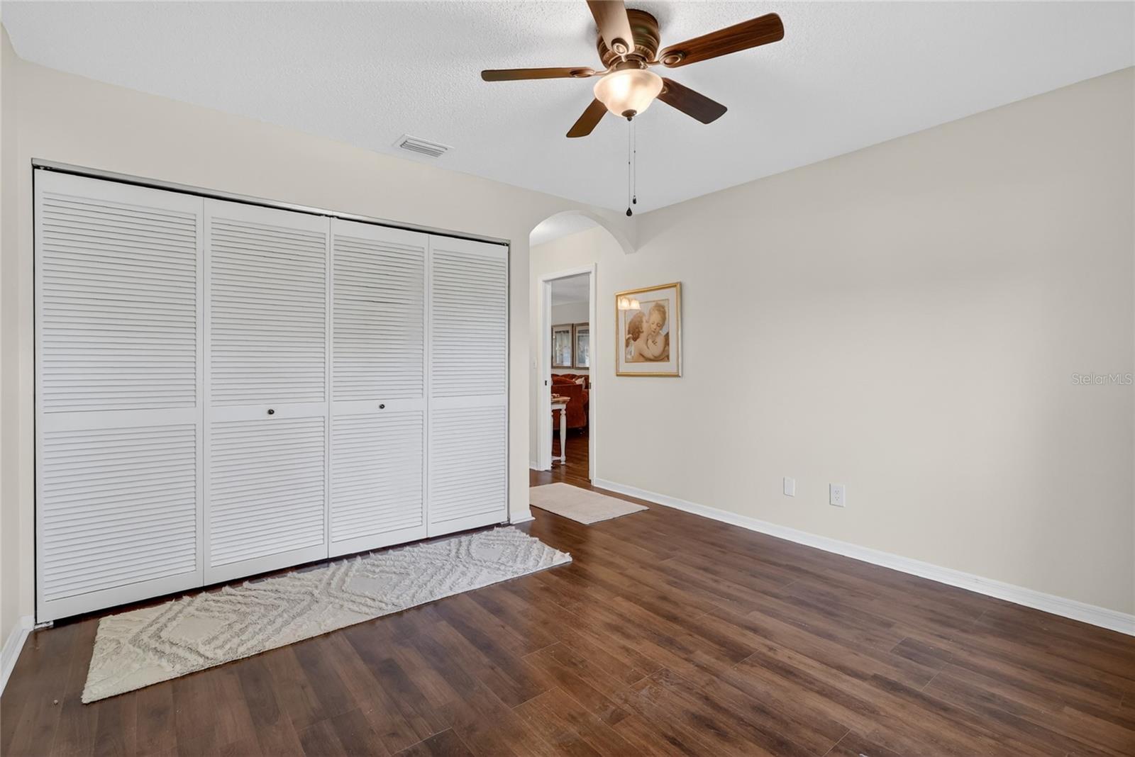Full wall closet in guest bedroom