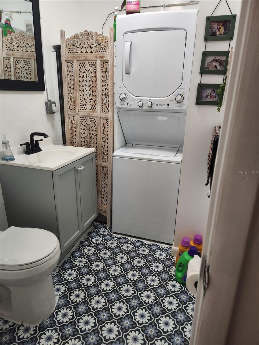 Half bath with laundry off of the garage.