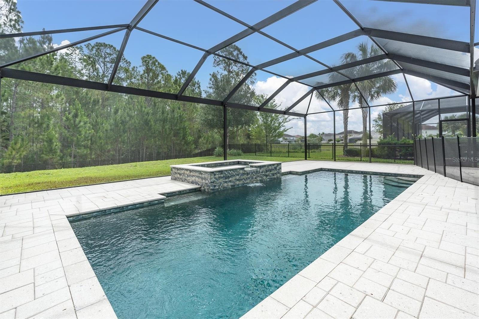 PANORAMIC SCREEN SURROUNDS THE HEATED SALTWATER POOL & SPA