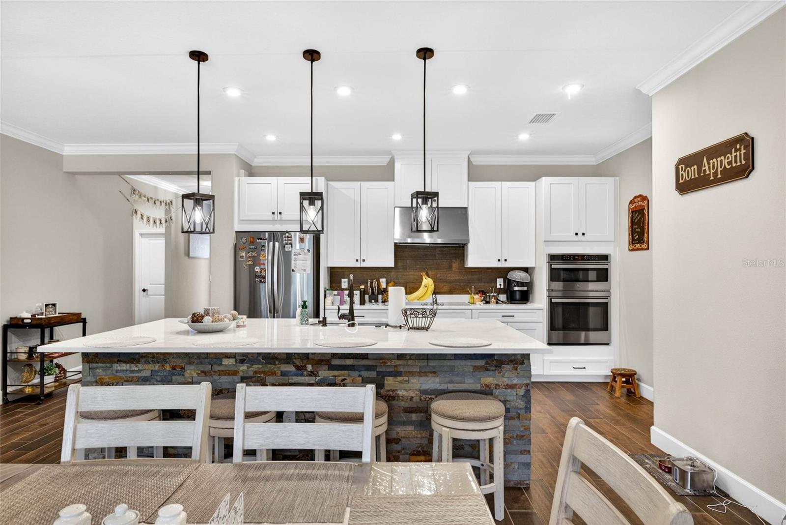 Kitchen is a part of the great room with dining area immediately in front.