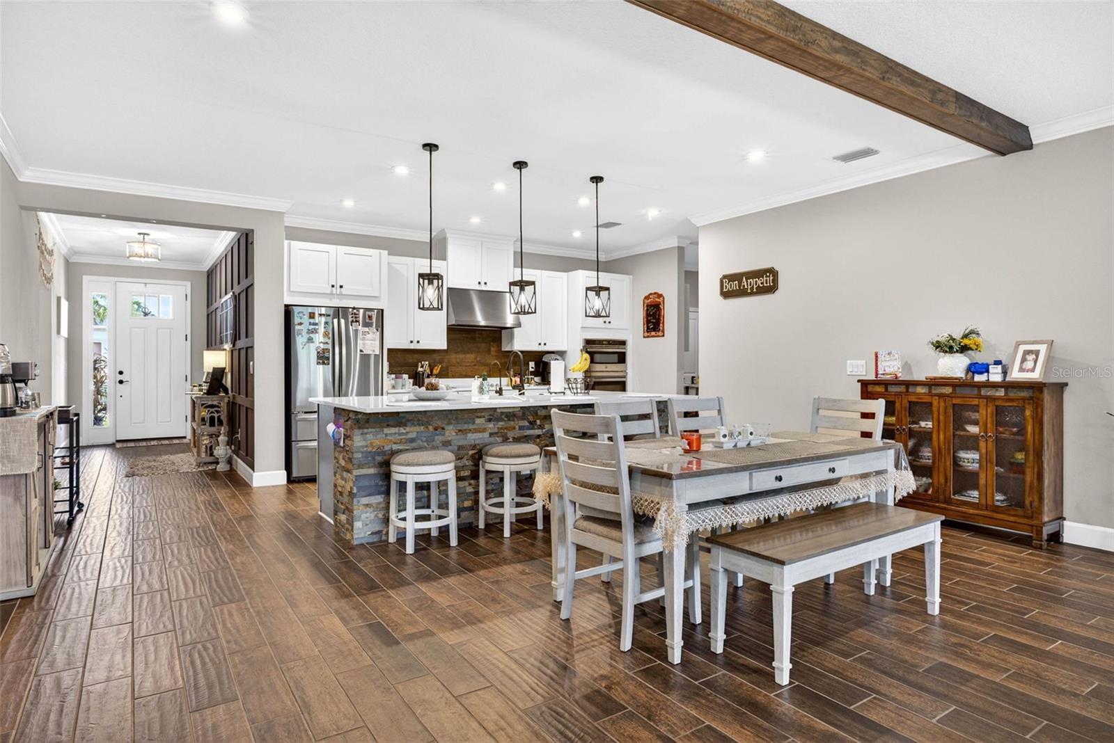 Beams along the ceiling create elongated views along high ceilings.