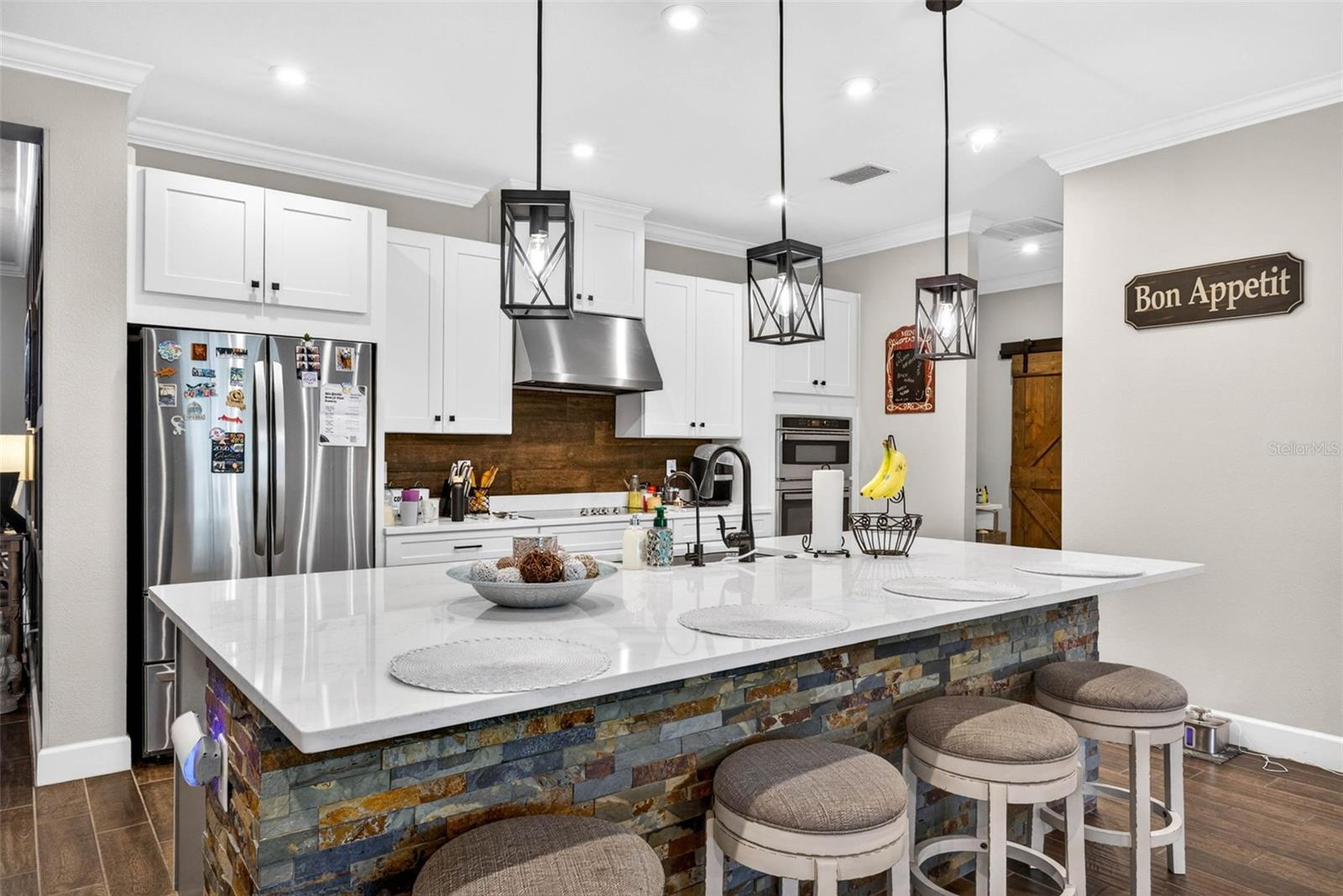 Upgraded kitchen, countertops, and lighting.