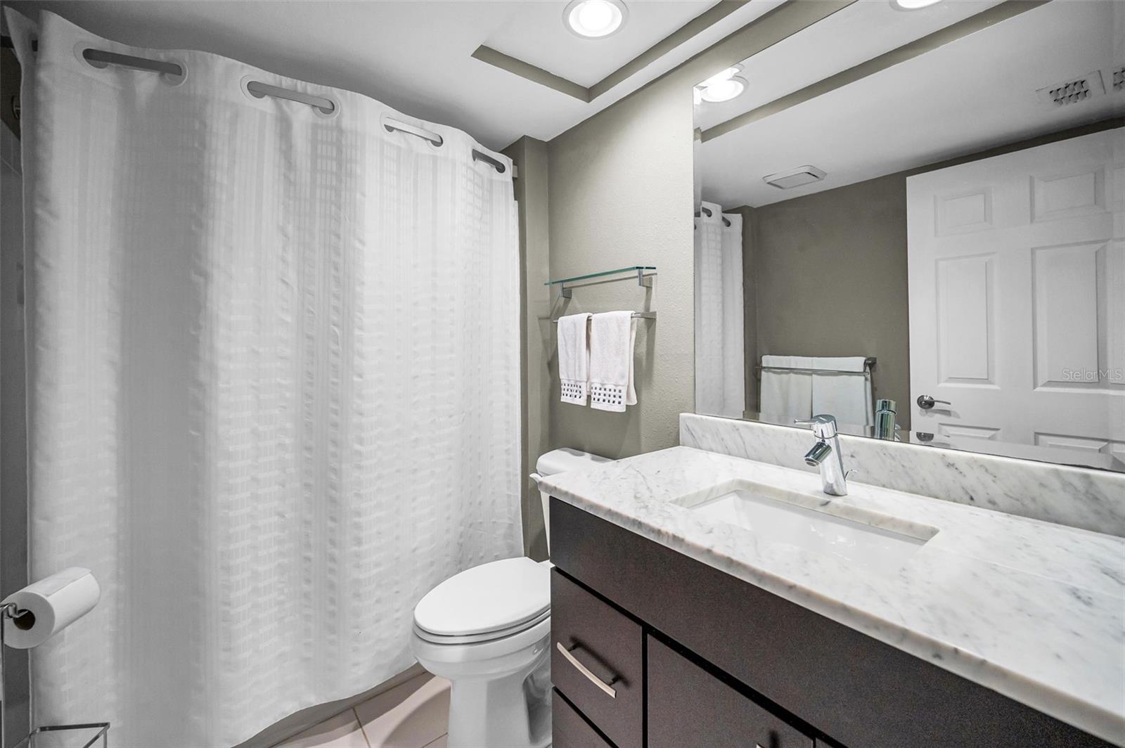 Updated guest bathroom with tub