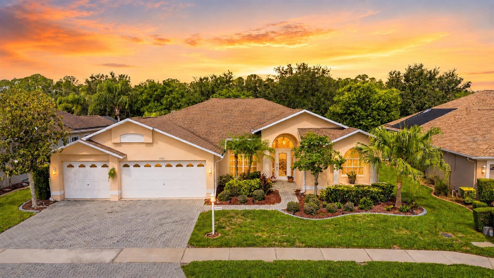 3-car garage and pavered driveway