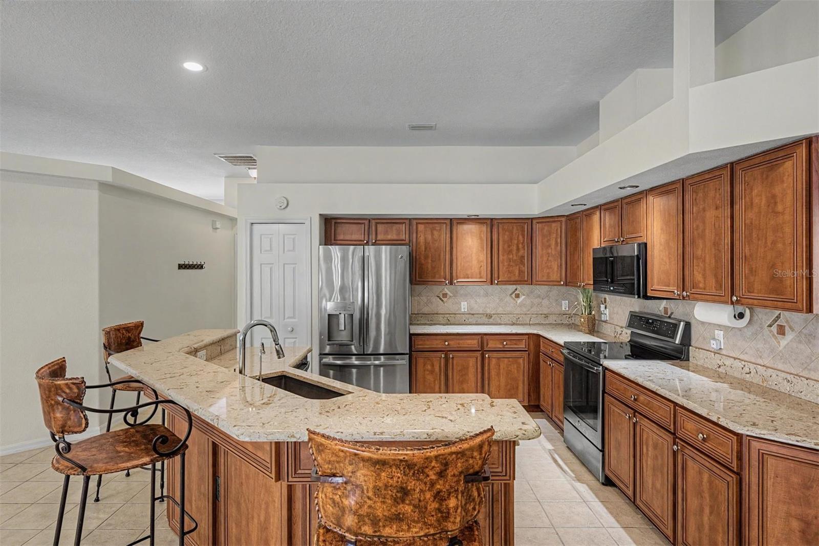Large kitchen provides breakfast bar seating
