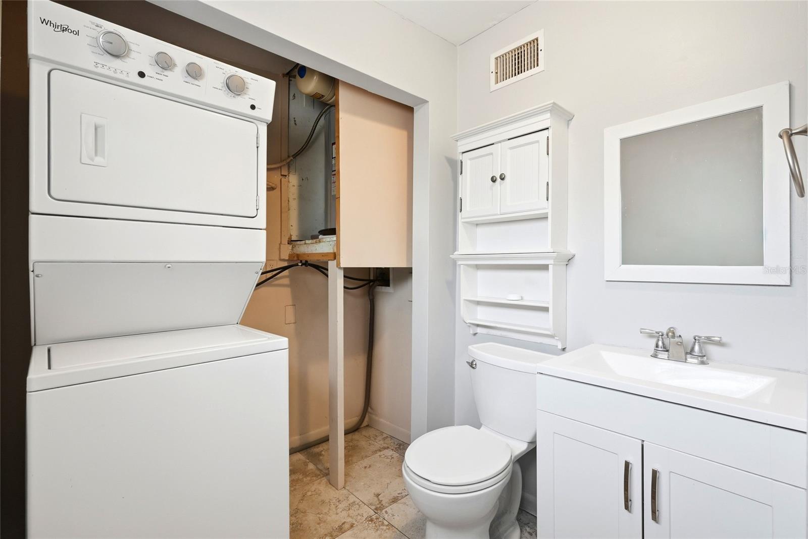 washer and dryer in primary bathroom