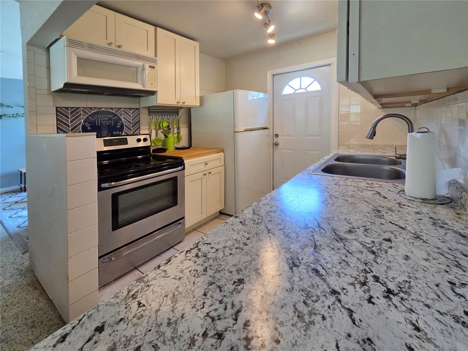Stainless stove, microwave & refrigerator