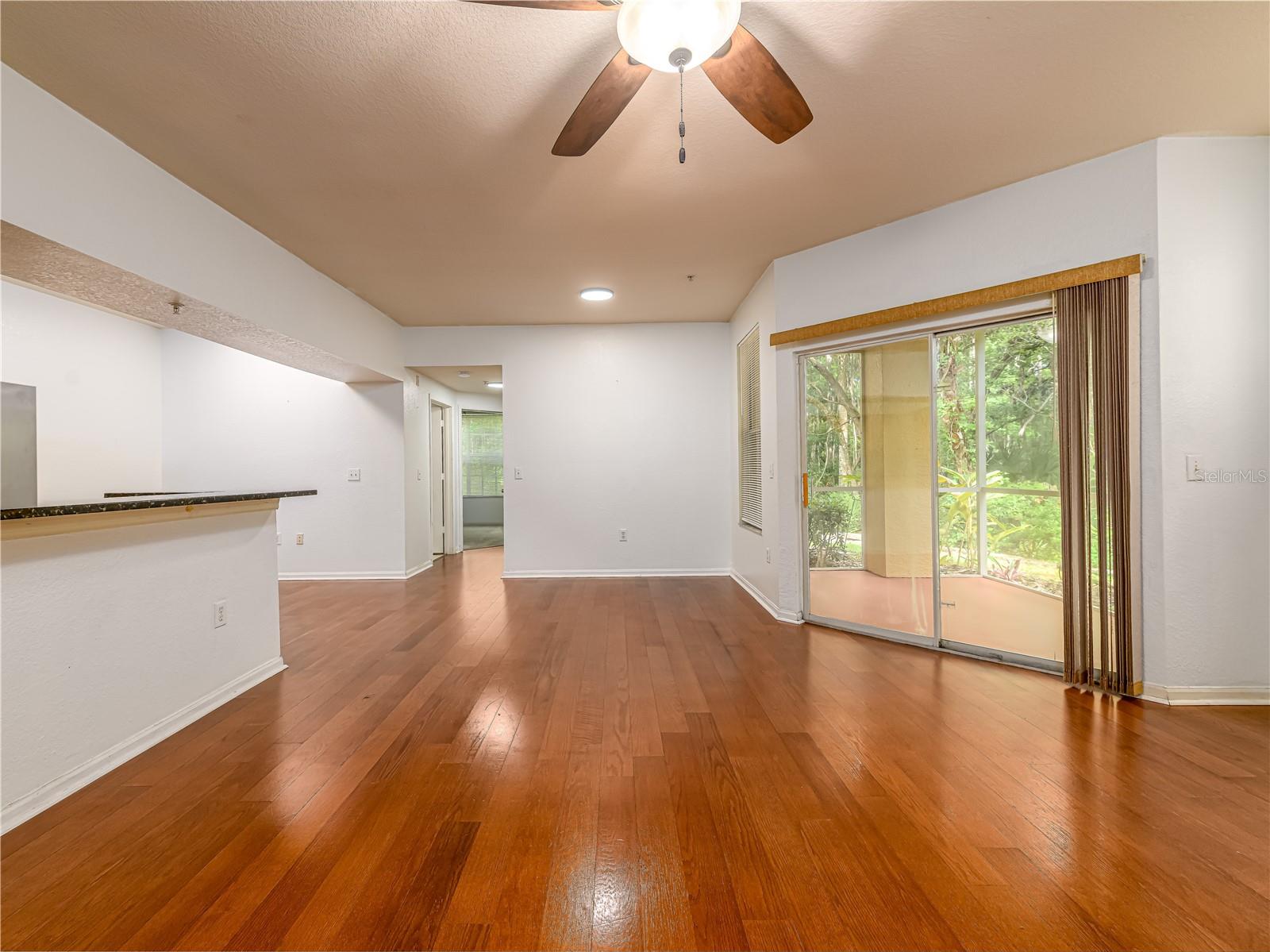 living area with kitchen  to the left