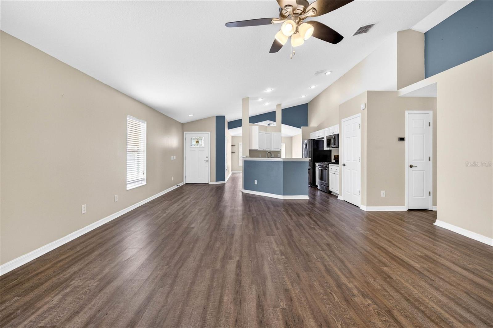 Kitchen looks out to both the dining area and living room.