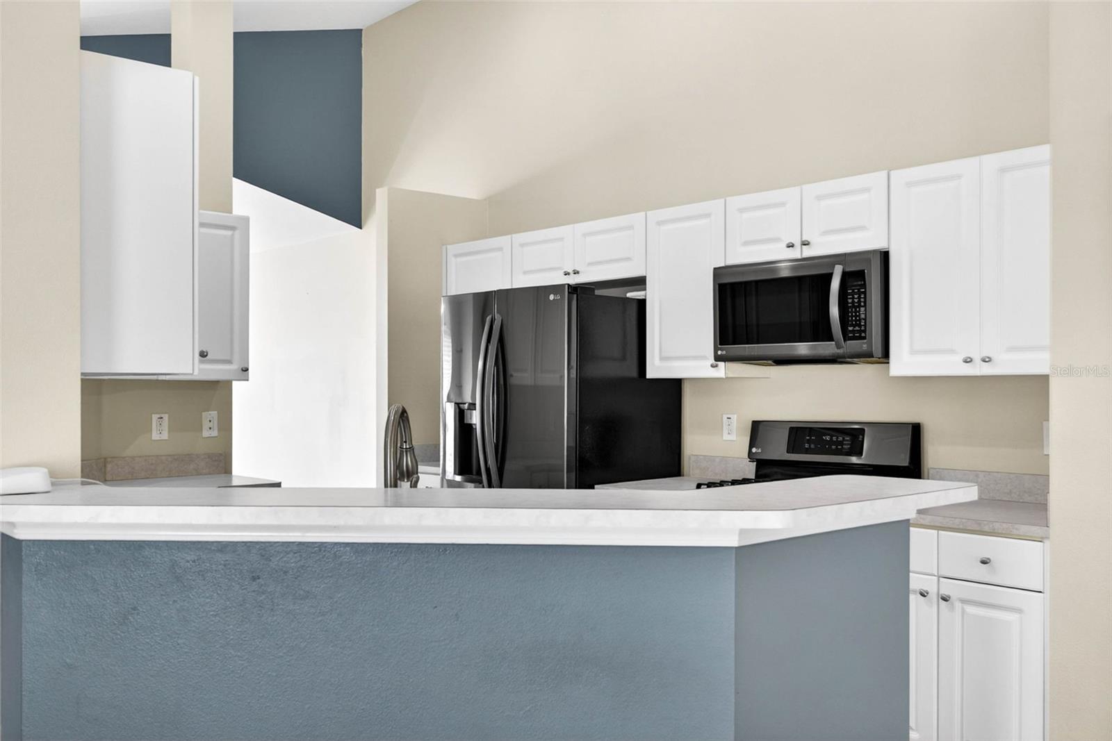 White cabinetry, & countertops, fresh interior paint.
