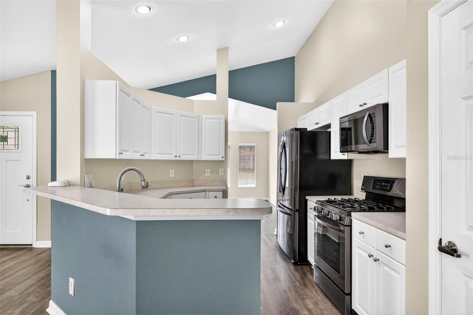 Kitchen is open to both areas for convenience