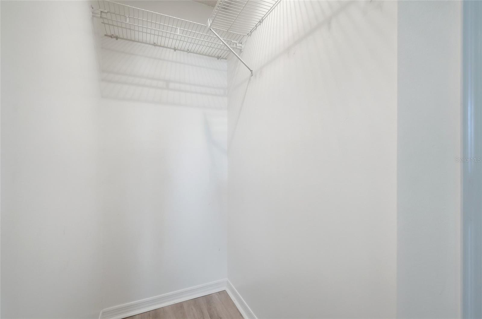 Large walk-in closet located in the Primary Bedroom.
