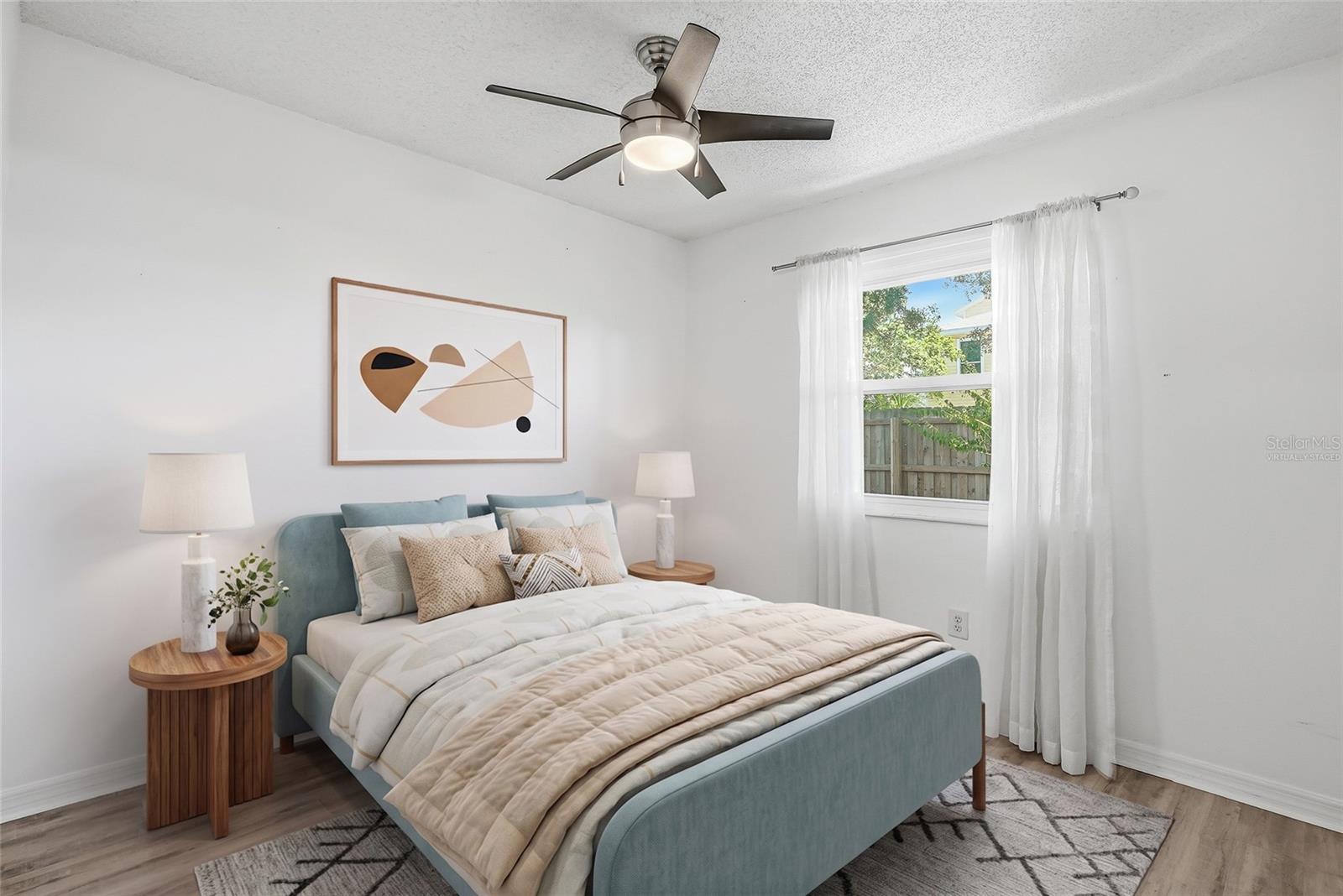 Virtually staged. Rear bedroom.