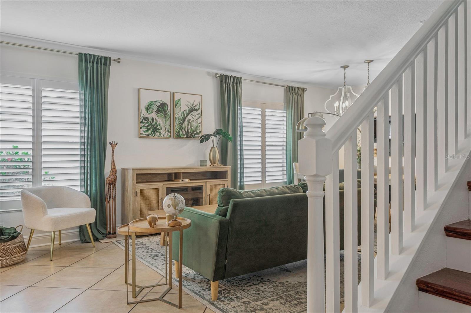 Spindles accent the staircase and give you a full view of your living room and foyer area.