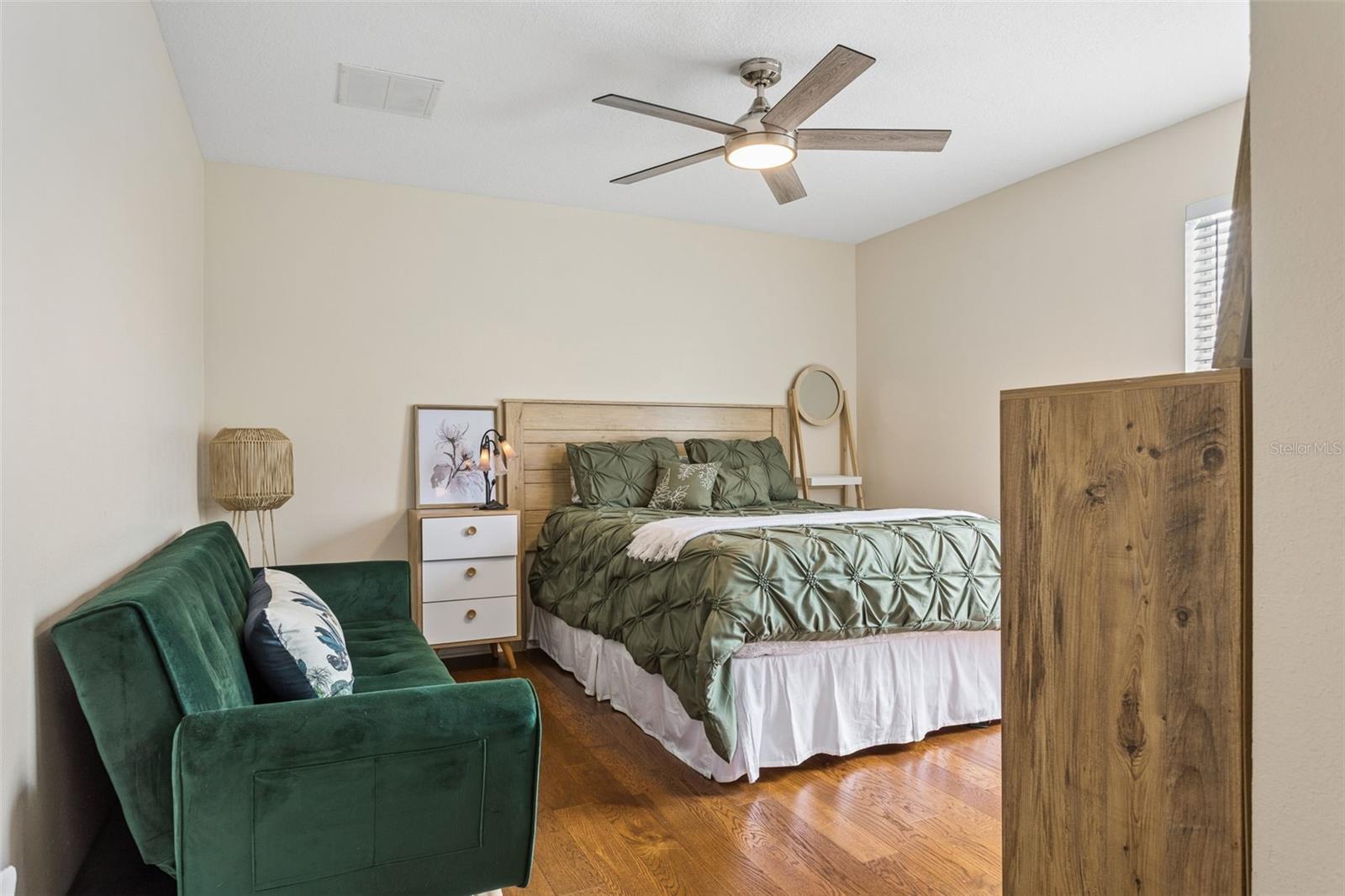Bedroom 3.  Look at the beautiful wood floors.  Freshly neutral painted walls