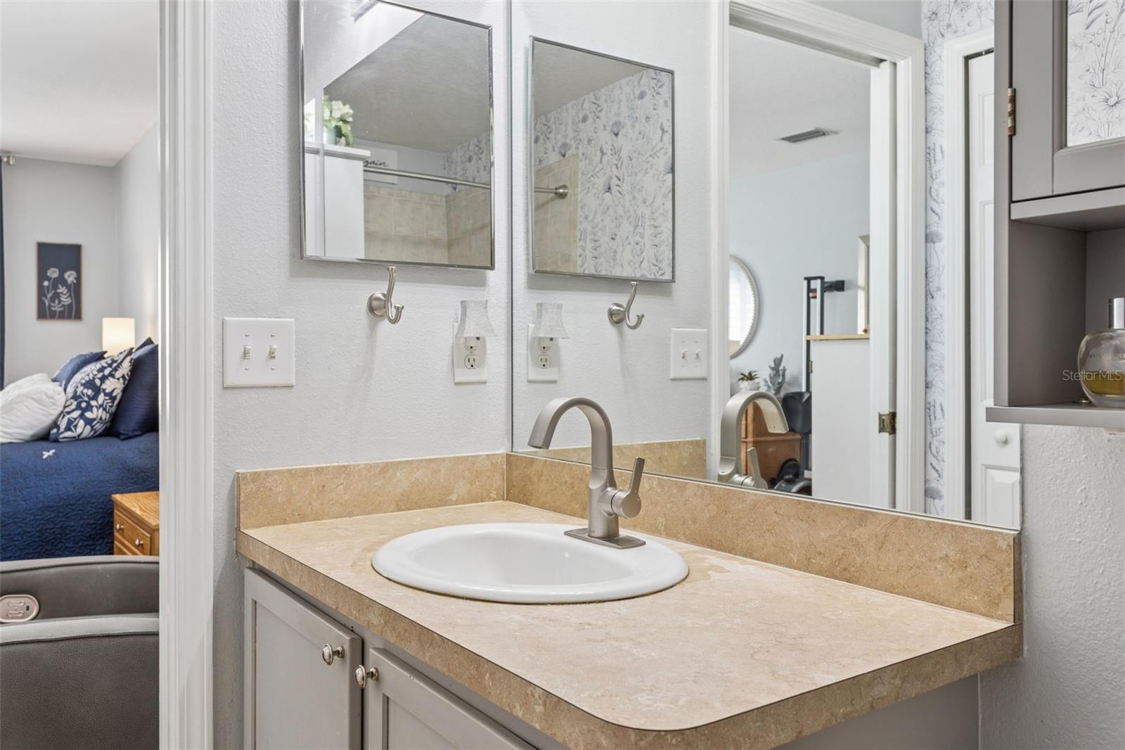 Look at the beautiful faucet and a pocket door for privacy and not disturb your other half.
