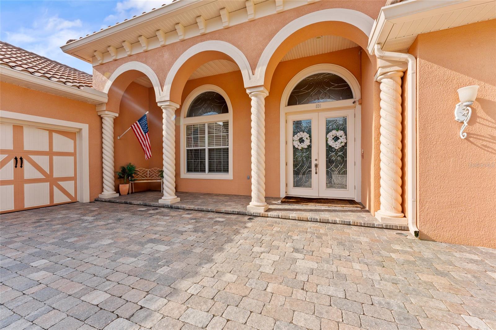 Covered entry with 10ft leaded glass doors