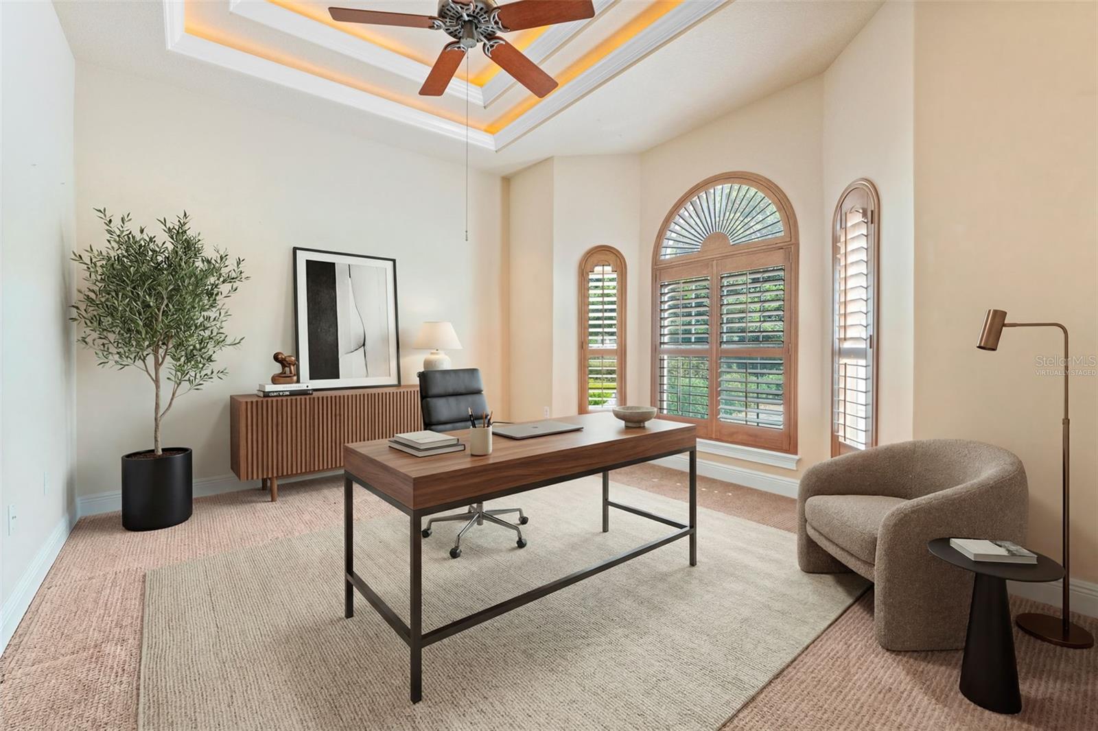 Virtually staged This spacious study is to right of entry. Features double tray ceiling, fan and bay window with plantation shutters.